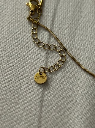 Collar de patito dorado