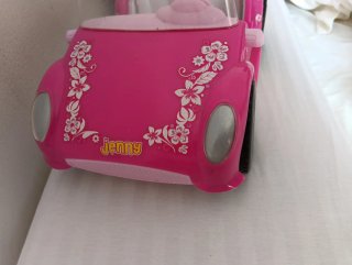 Coche rosa para muñecas
