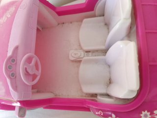 Coche rosa para muñecas