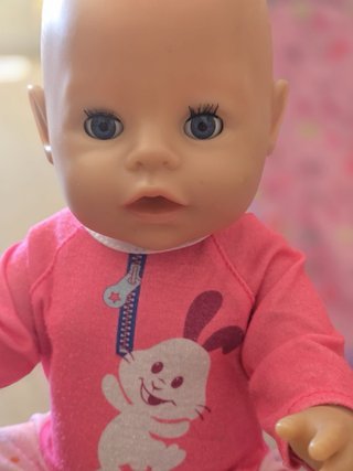 Muñeco Baby Born con silla