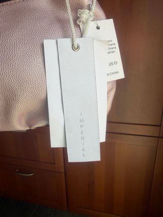 Pochette rosa nuova con cartellino