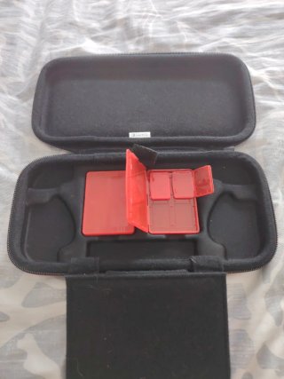 Funda Oficial Nintendo Switch + Cajas Cartuchos