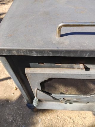 Estufa de leña con horno superior