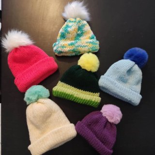 Cappelli di lana con pompon