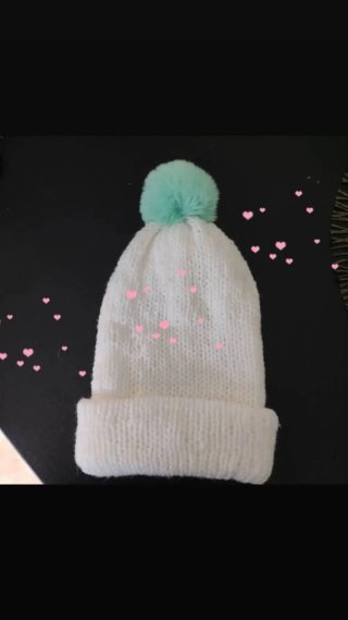 Cappelli di lana con pompon