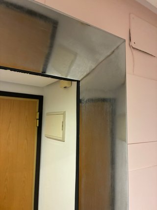Espejo de pared plateado