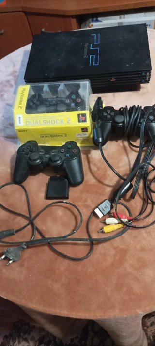 Lote PlayStation 2 con accesorios