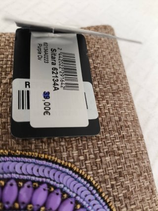 Cartera de mano con pedrería violeta