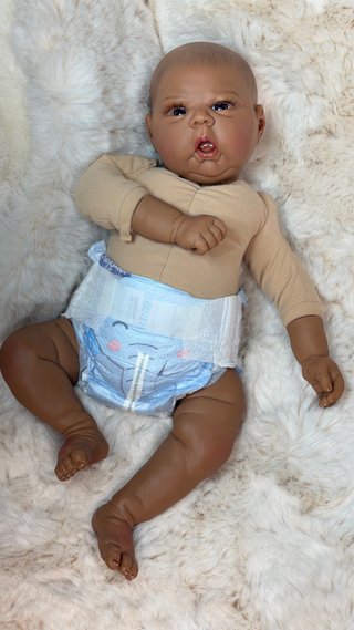 Muñeco bebé Reborn realista mulato