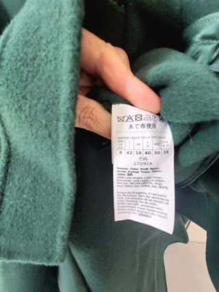 Cappotto in lana verde con cintura