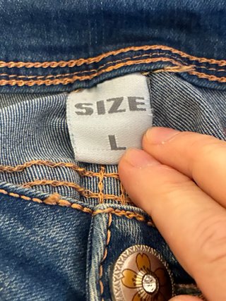 Pantaloni jeans vintage con stampa floreale