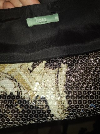 Blusa elegante negra y dorada