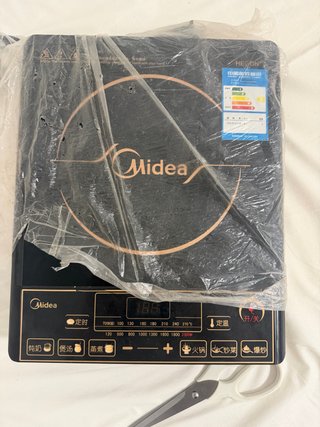 Placa de inducción Midea negra