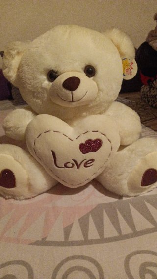 Oso de peluche blanco con corazón
