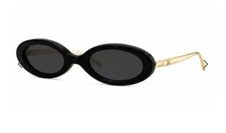 Gafas de sol ovaladas Chanel negras y doradas