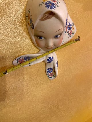 Volto con fiori cacciapuoti