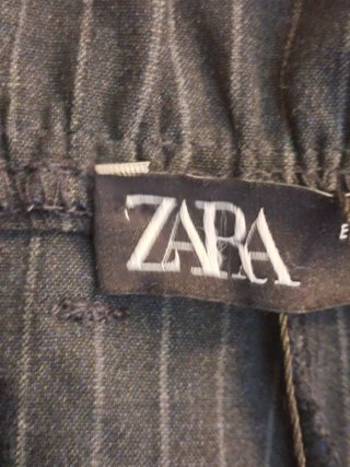 Pantaloni donna a righe con banda laterale