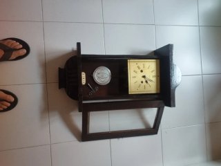 Reloj de pared madera y dorado