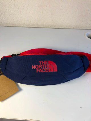 Riñonera The North Face azul y roja