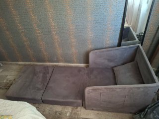 Sillón cama gris de tela