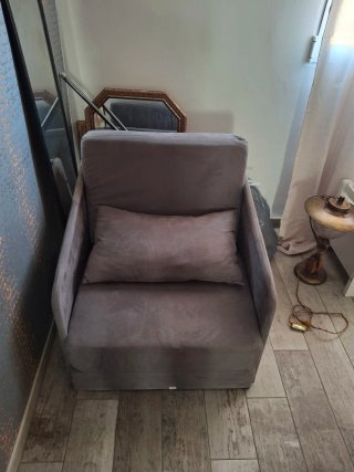 Sillón cama gris de tela
