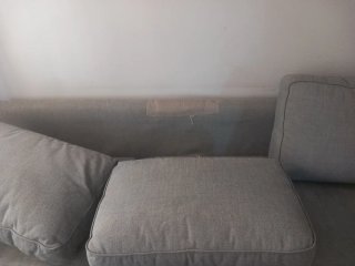 Sofá cama gris de tela
