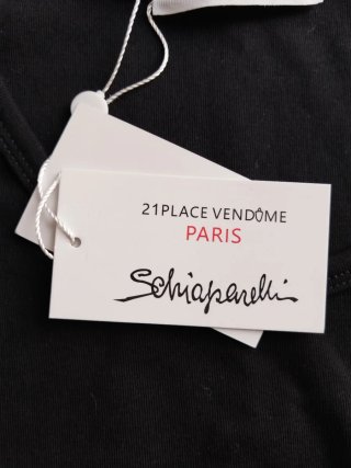 Top Schiaparelli nero con spille oro