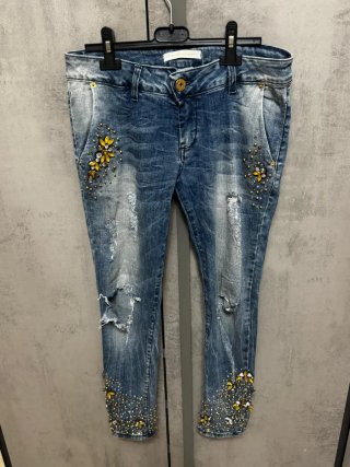 Jeans donna con strass e strappi