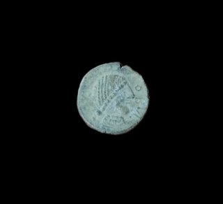 Moneda antigua de plomo