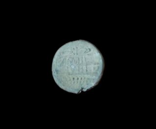 Moneda antigua de plomo