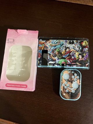 Funda Nintendo Switch One Piece + Grips . Nueva