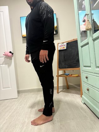 Pantaloncini da corsa Nike e felpa neri