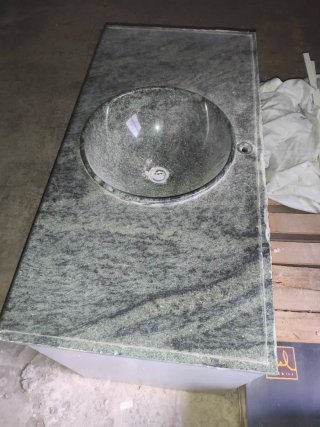 Lavabo de mármol con mueble de madera