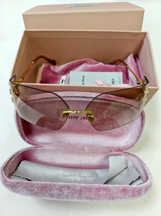 Gafas Miu Miu doradas sin montura