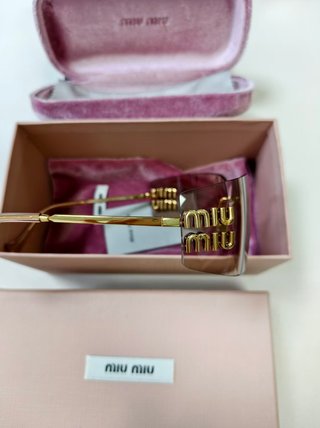 Gafas Miu Miu doradas sin montura