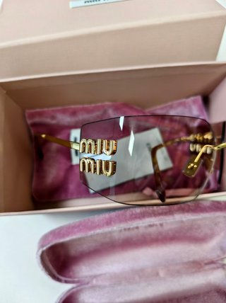 Gafas Miu Miu doradas sin montura
