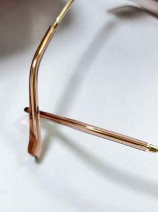 Gafas Miu Miu doradas sin montura