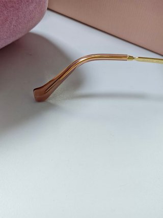 Gafas Miu Miu doradas sin montura