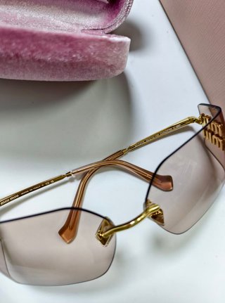 Gafas Miu Miu doradas sin montura