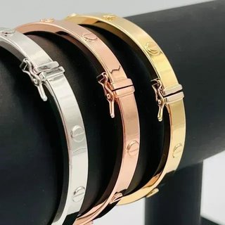 PULSERA RIGIDA TORNILLO ORO ROSA. Hueca. Oro 18k.