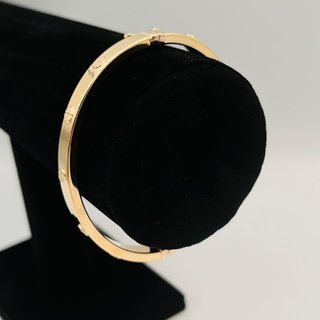PULSERA RIGIDA TORNILLO ORO AMARILLO. Hueca. 18K.