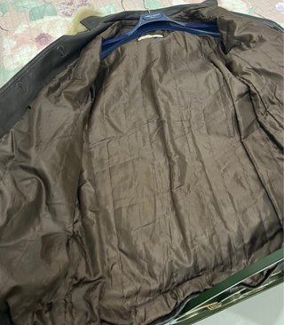 Cappotto in pelle con cappuccio