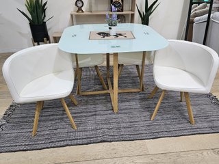 Mesa de cristal templado y 4 sillas blancas