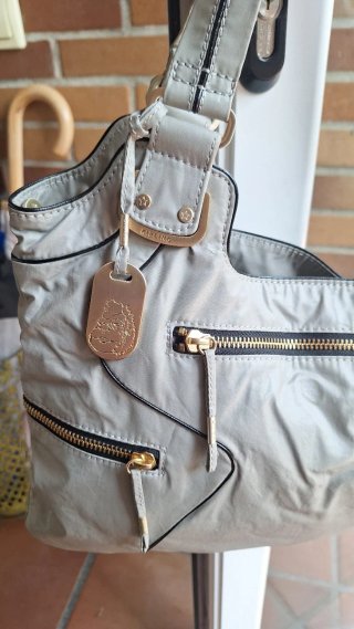 Bolso Kipling Gris con Colgante Monito