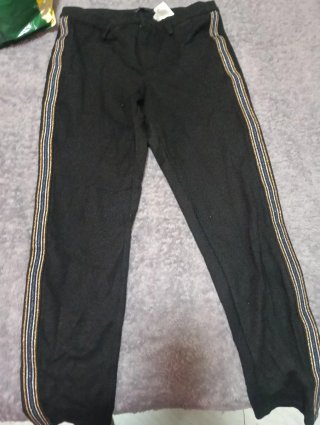 Pantalón de malla con detalles dorados