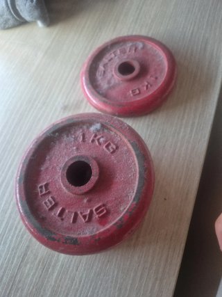 4 discos de pesas rojos 1 kg