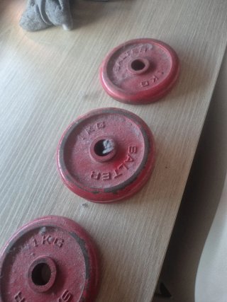 4 discos de pesas rojos 1 kg
