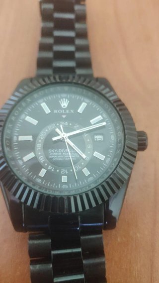 Reloj Rolex Negro y Plateado