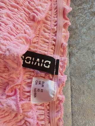 Blusa rosa con volantes y manga larga
