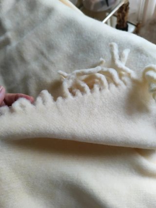 Manta beige con flecos